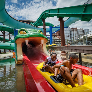 The Viper at ZDT's Amusement Park - Two children emerge riding in a raft from the viper water slide.