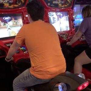 Video Game Arcade at ZDT's Amusement Park - Teenagers play Fast n Furious Super Bikes arcade game set on free play.